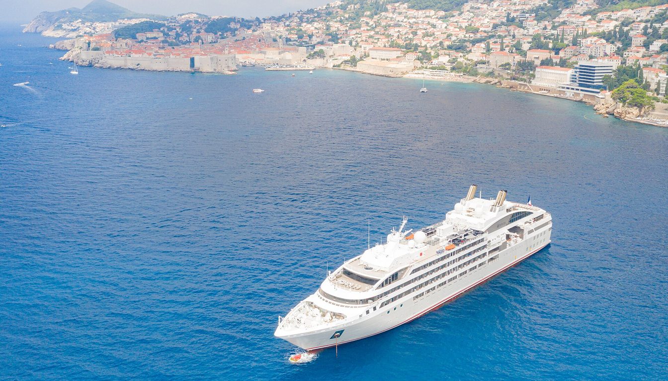 Cruise ship anchored in the Adriatic off Dubrovnik's walled Old Town and the Ploče coastline